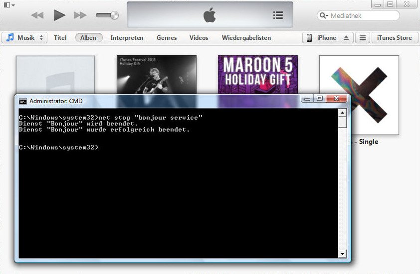 Screenshot of iTunes and the CMD window